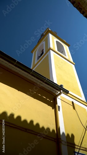 Beautiful bell tower painted on yellow, in Bellús, Valencia (Spain)