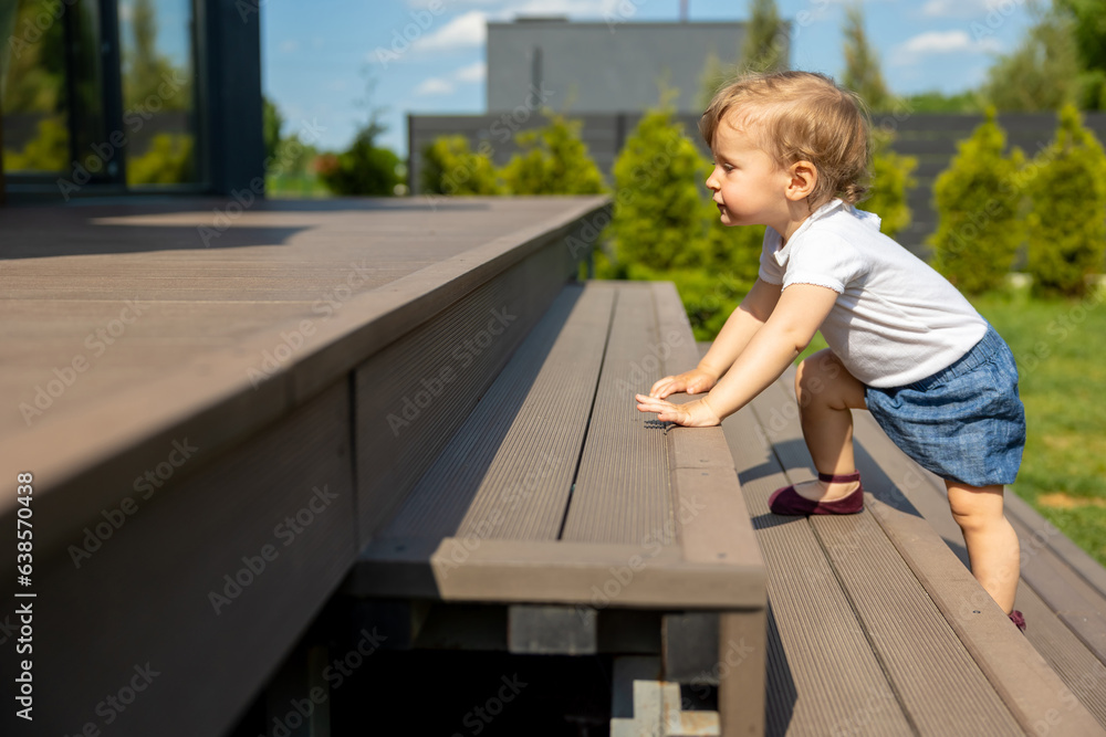 Cute little fair-haired kid on the steps Cute little fair-haired kid on the steps