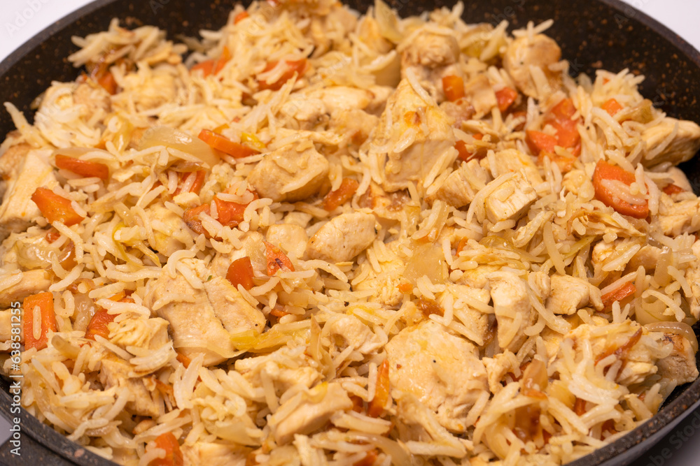 Tasty pilaf with chicken as background. Tasty pilaf with chicken as background.