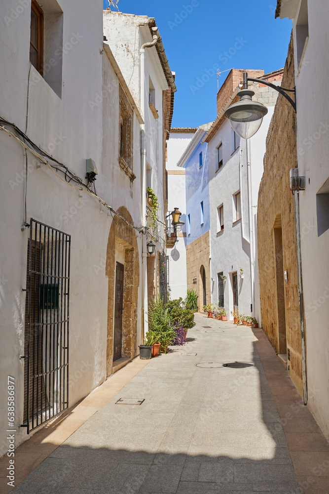A narrow street of the old town without people.