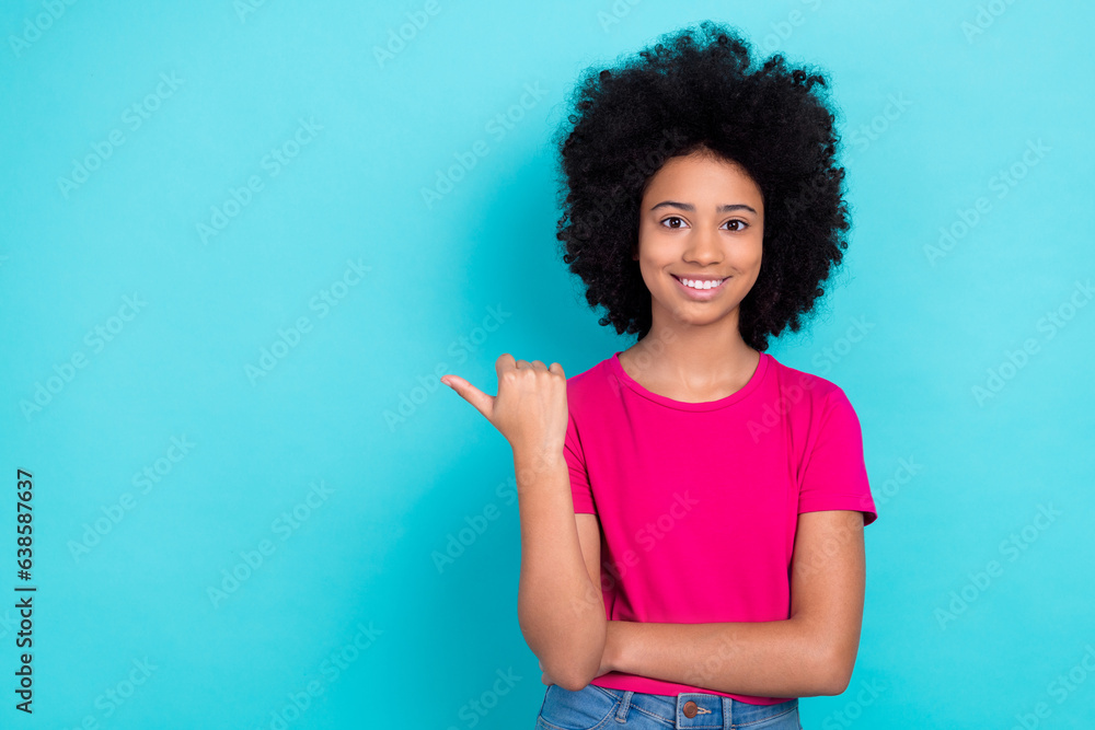 Portrait of cute cheerful girl toothy smile indicate thumb finger empty space proposition isolated on turquoise color background Portrait of cute cheerful girl toothy smile indicate thumb finger empty space proposition isolated on turquoise color background
