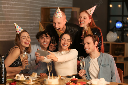 Group of young friends with...