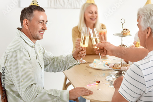 Happy adult friends celebra...