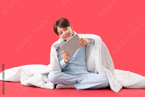 Little boy with blanket and...