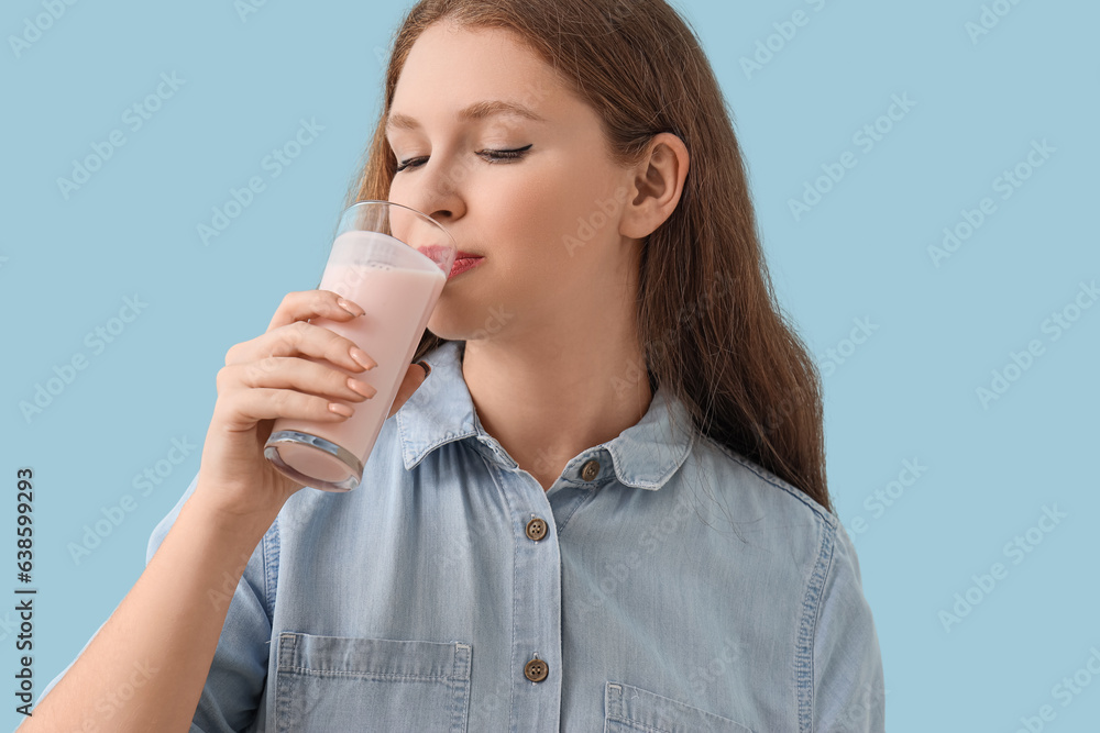 Young woman drinking tasty yoghurt on blue background, closeup Young woman drinking tasty yoghurt on blue background, closeup
