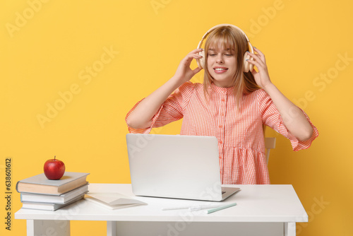 Young woman wearing headpho...