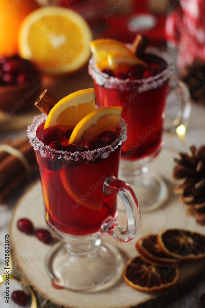 Glasses with warm cranberry with oranges drinks Glasses with warm cranberry with oranges drinks