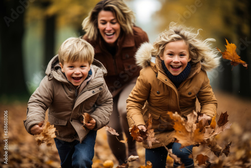 Family playing in fallen leaves 