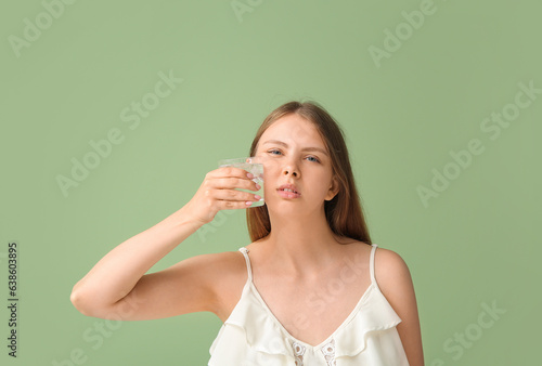 Young woman with tooth ache...
