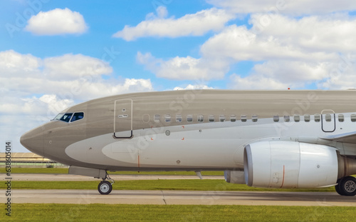 Fotografie Airplane without logos, lateral view at the airport
