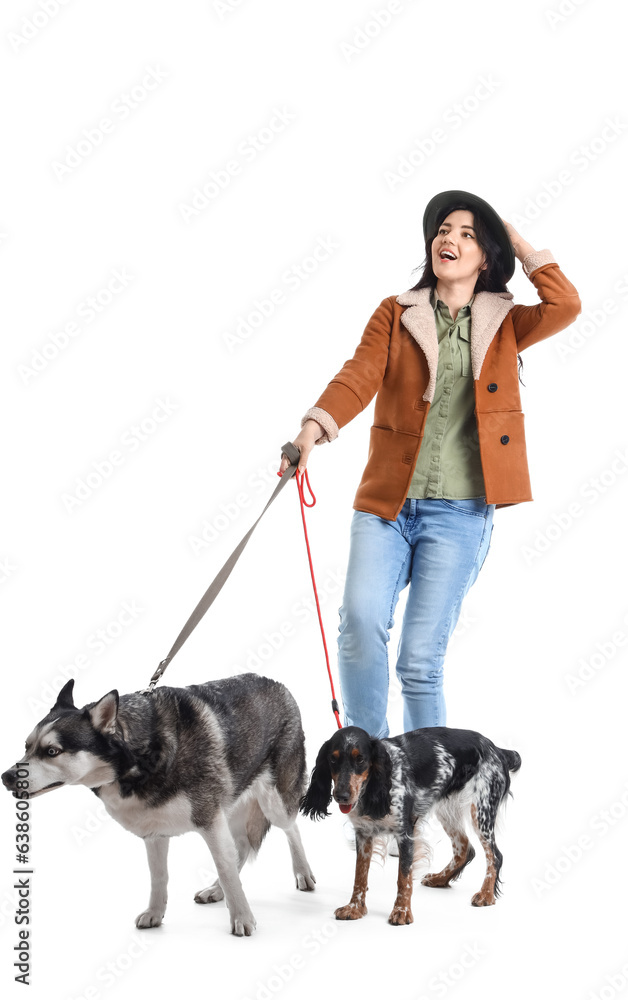 Young woman with cute dogs walking on white background Young woman with cute dogs walking on white background