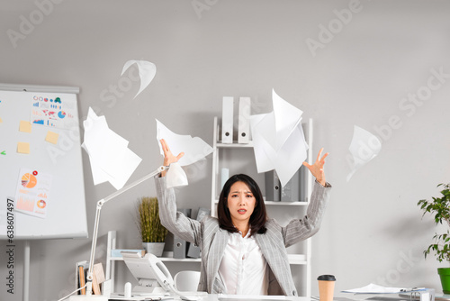 Stressed Asian businesswoma...