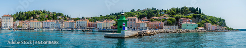 A panorama view across the entrance to the outer harbour in the town of Piran, Slovenia in summertime