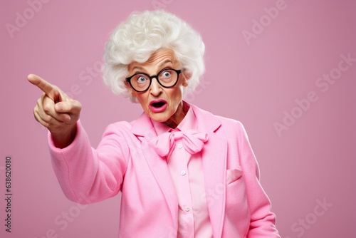 Elderly woman pointing finger up.
