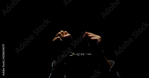 Shrouded Guilt. The Haunting Desperation of a Handcuffed Businessman, Clad in Darkness, Conveying a Raw Mix of Sin, Innocence, and Utter Hopelessness.