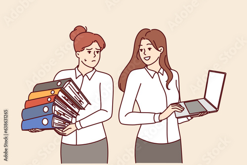 Successful woman with laptop recommends to colleague to abandon paperwork and start digitalizing business. Girl with folders of documents needs to digitalizing workflows to increase productivity