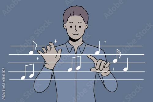 Man conductor moves hands, standing near imaginary notes and comes up with new musical composition for musicians. Conductor of symphony orchestra rehearses before going on stage to audience