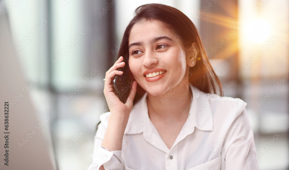 Portrait of young business woman with glasses ofand talking on mobile phone Portrait of young business woman with glasses ofand talking on mobile phone