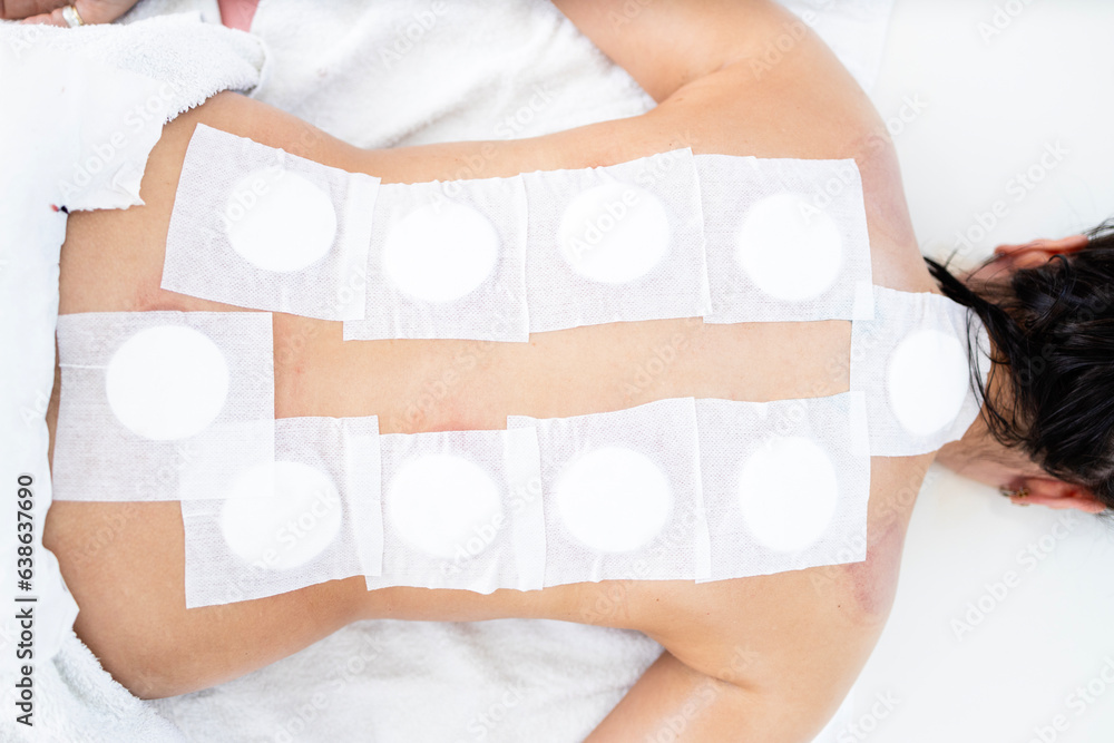 Top view of patient back, disinfected and protected with sticking