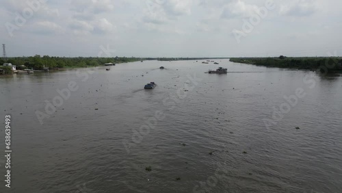 Aerial view of a ferry boat crossing the Mekon River in Vietnam photo