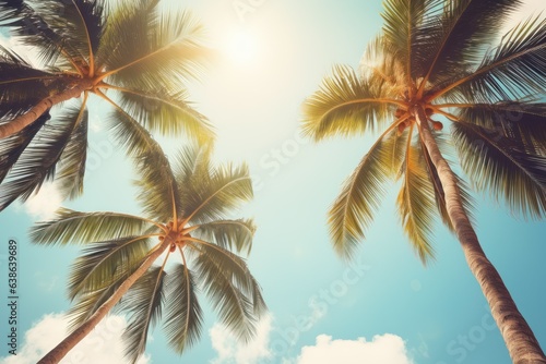 Vintage Tropical Reverie: Gazing Up at Palm Trees against a Blue Sky, Evoking Summer Vibes on a Serene Beach
