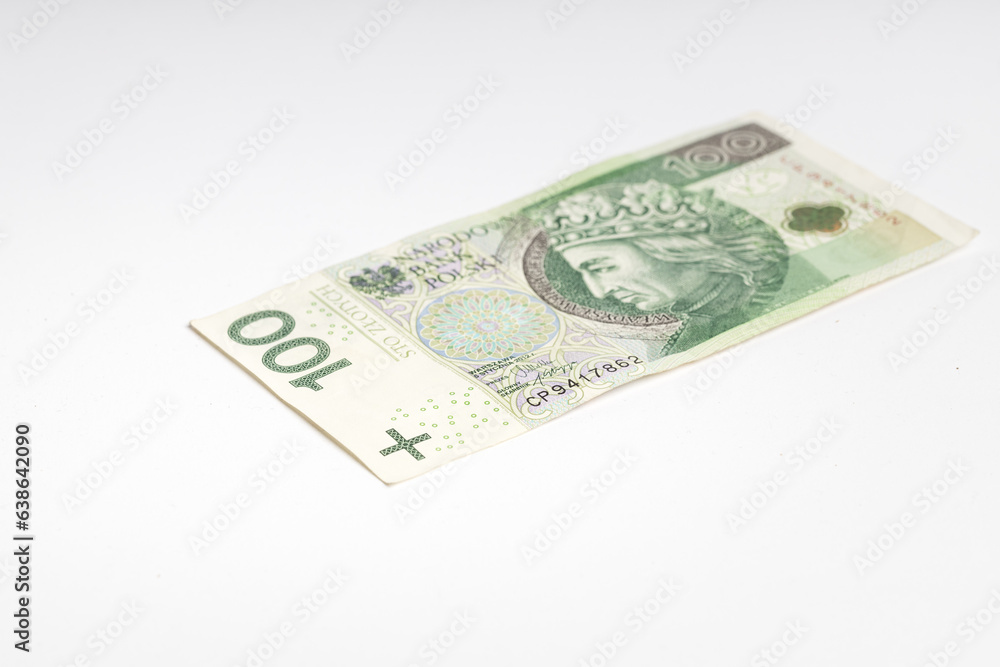 Polish banknote PLN lying on a white background (selective focus) Polish banknote PLN lying on a white background (selective focus)