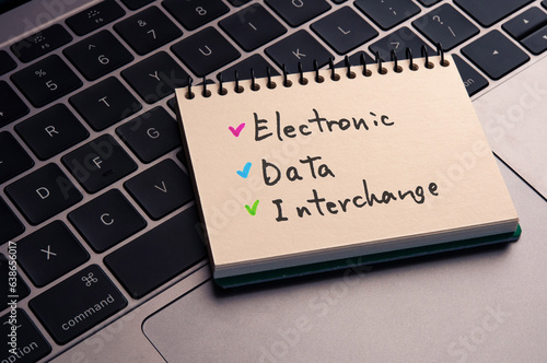 There is notebook with the word Electronic Data Interchange. It is as an eye-catching image. photo