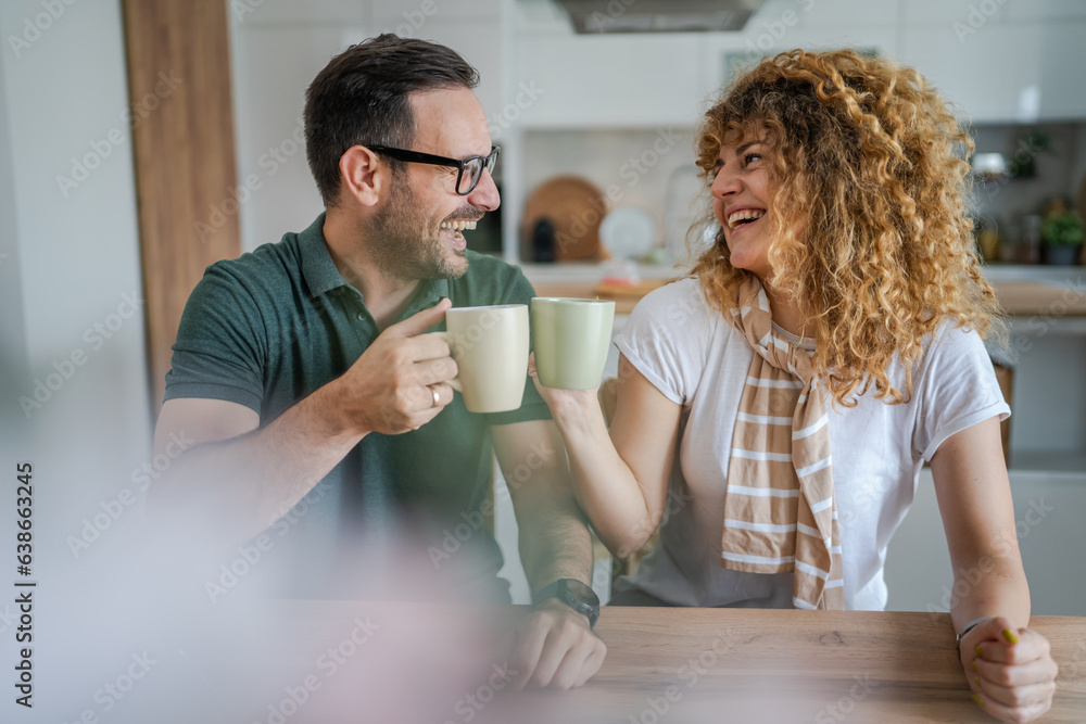Young couple man and woman enjoy cup of tea or coffee in the morning Young couple man and woman enjoy cup of tea or coffee in the morning