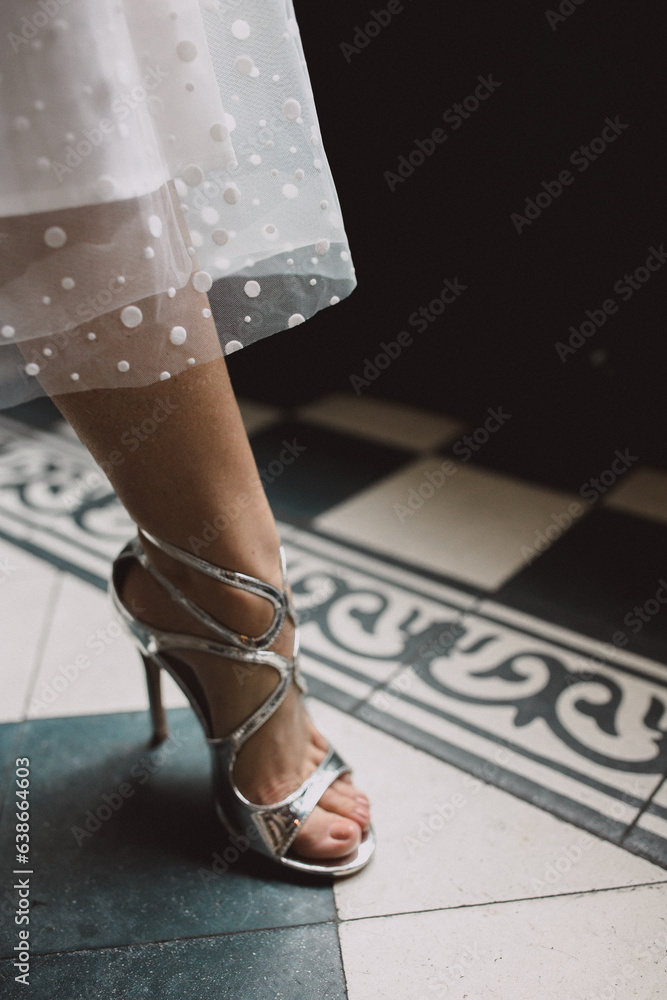 legs of a bride in a dress