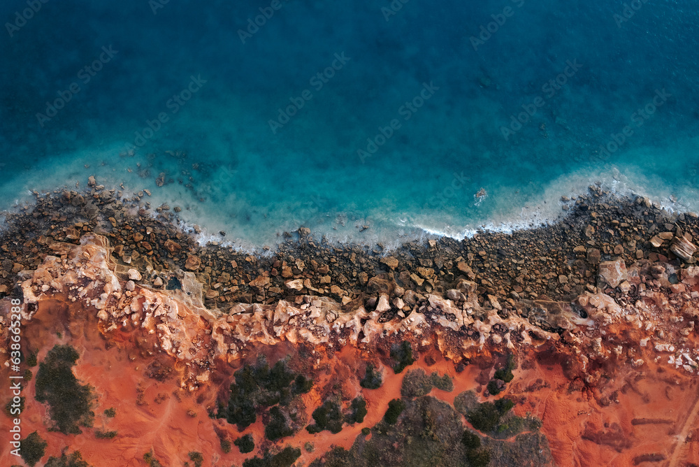 Aerial view of where the red dirt meets the ocean
