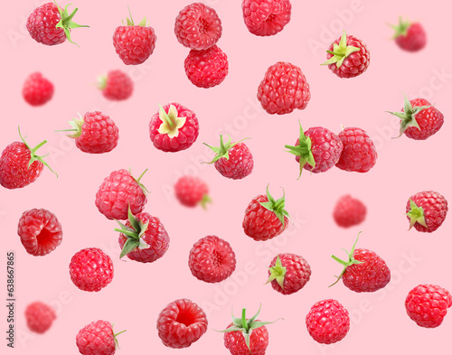 Many fresh ripe raspberries falling on pink background