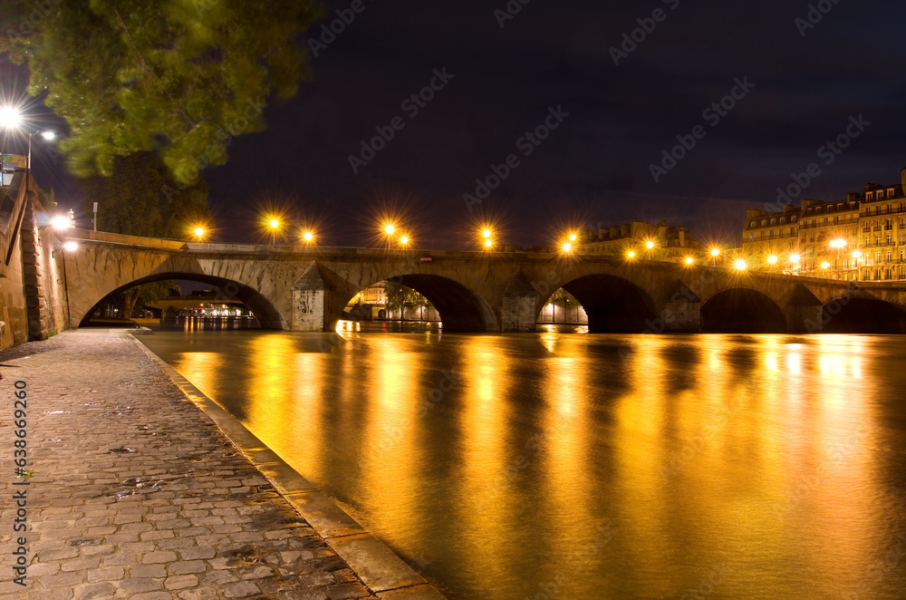 River Seine and Pont Royal bridge at night, Paris, France