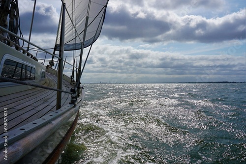 Sailboat action for travel across rivers and seas. Navigate to destinations and goals to achieve. Wind energy as propulsion over water.