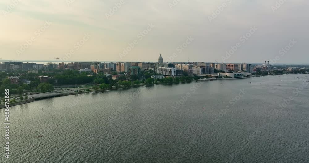 Flying above the lake towards city of Madison in Wisconsin. Late afternoon light Flying above the lake towards city of Madison in Wisconsin. Late afternoon light