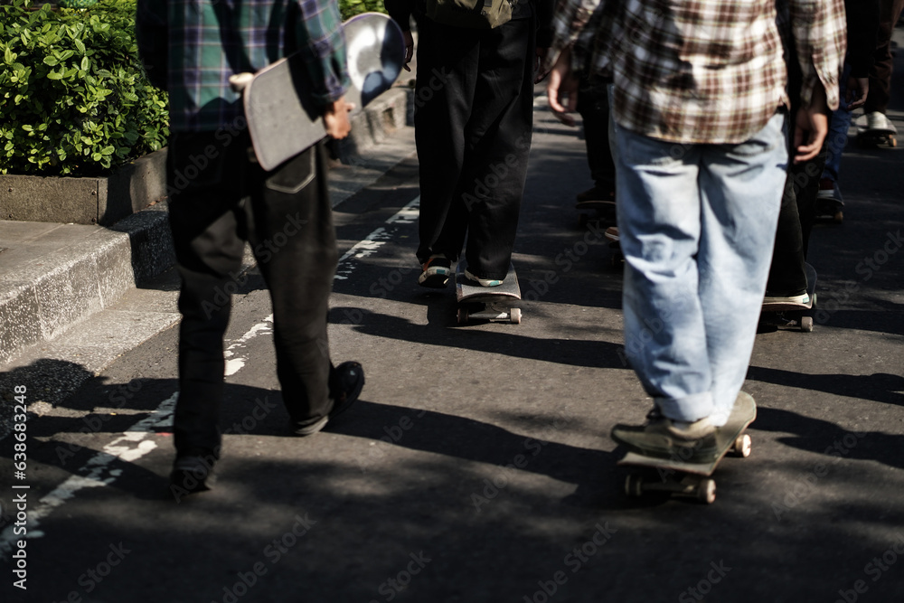 skateboarders or skaters get together and play on the street in freestyle, celebrating world skateboard day. skateboarders or skaters get together and play on the street in freestyle, celebrating world skateboard day.