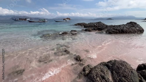 A beach with pink-colored sand located in the Komodo National Park in East Nusa Tenggara, Indonesia. photo