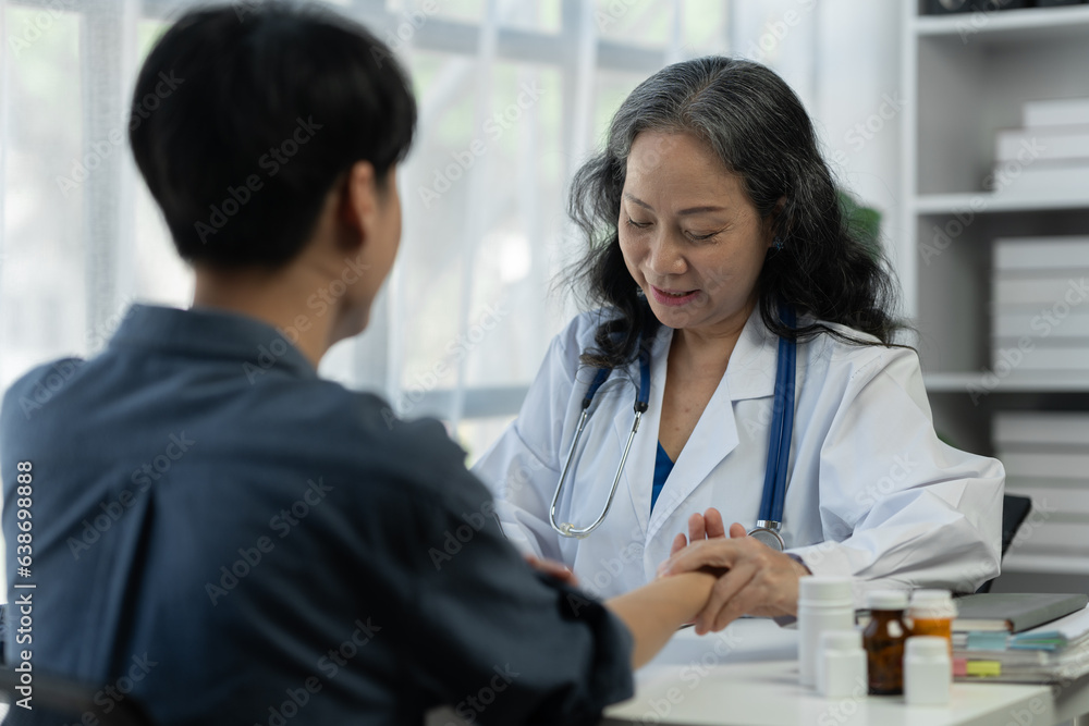 Health care and treatment concept. Senior female doctor using pulse monitor. The patient's heartbeat for preliminary processing before examination and diagnosis of the patient's disease at the clinic Health care and treatment concept. Senior female doctor using pulse monitor. The patient's heartbeat for preliminary processing before examination and diagnosis of the patient's disease at the clinic