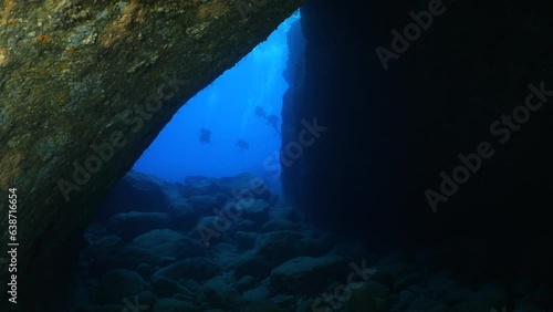 Wallpaper Mural cave diving underwater scuba divers exploring caves and having fun ocean scenery sun beams and rays background Torontodigital.ca