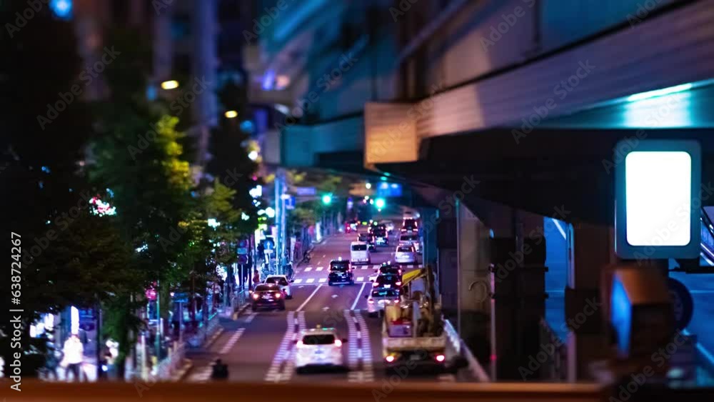 A night timelapse of the miniature traffic jam at the city street in Tokyo tilt A night timelapse of the miniature traffic jam at the city street in Tokyo tilt