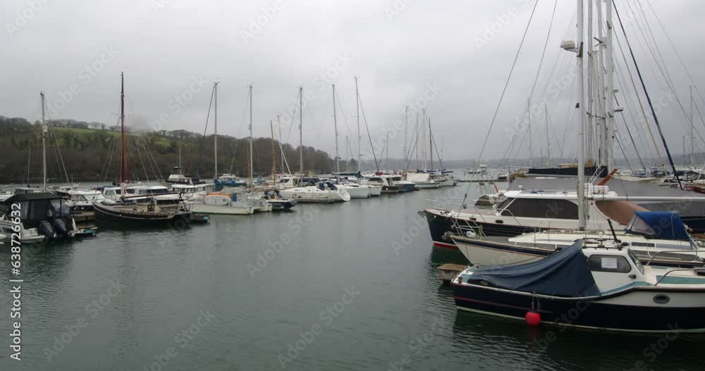 Wide shot in the rain of Boats Yachts Moored Up On The Floating Harbour At Mylor Yacht, Churchtown Wide shot in the rain of Boats Yachts Moored Up On The Floating Harbour At Mylor Yacht, Churchtown