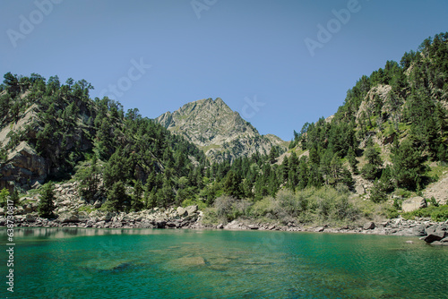 Beautiful idyllic lake next to a mountain during a summer day