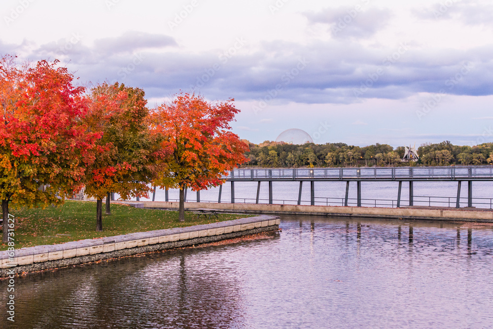 St. Lawrence River with bright maple trees, in Montreal, Canada.