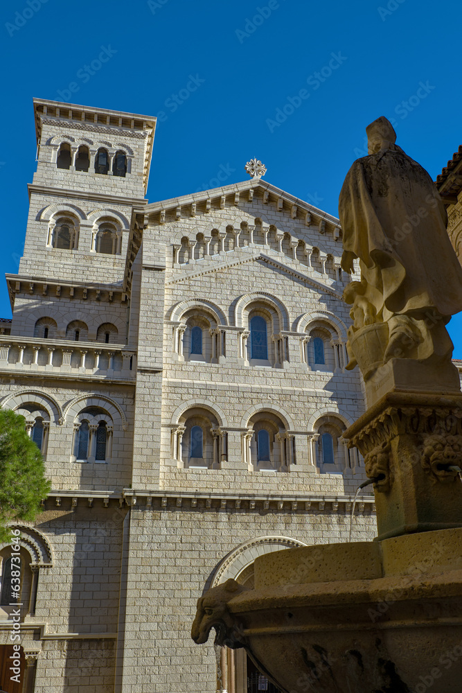 Saint Nicholas Cathedral in Monaco from a side with statue in foreground