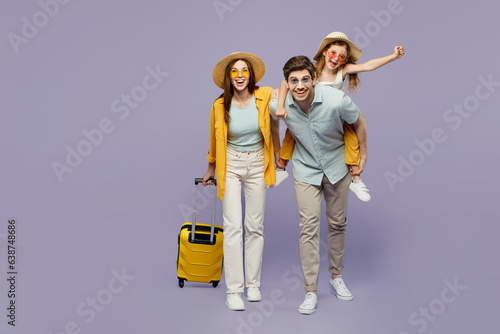 Traveler parents mom dad with child girl wear casual clothes hold bags, sit on back isolated on plain purple background Tourist travel abroad in free time rest getaway Air flight trip journey concept #638748686