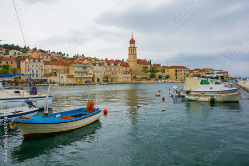 The harbour of the historic village of Sutivan on Brac Island in Croatia. The Church of the Assumption of the Blessed Virgin Mary is centre © dragoncello