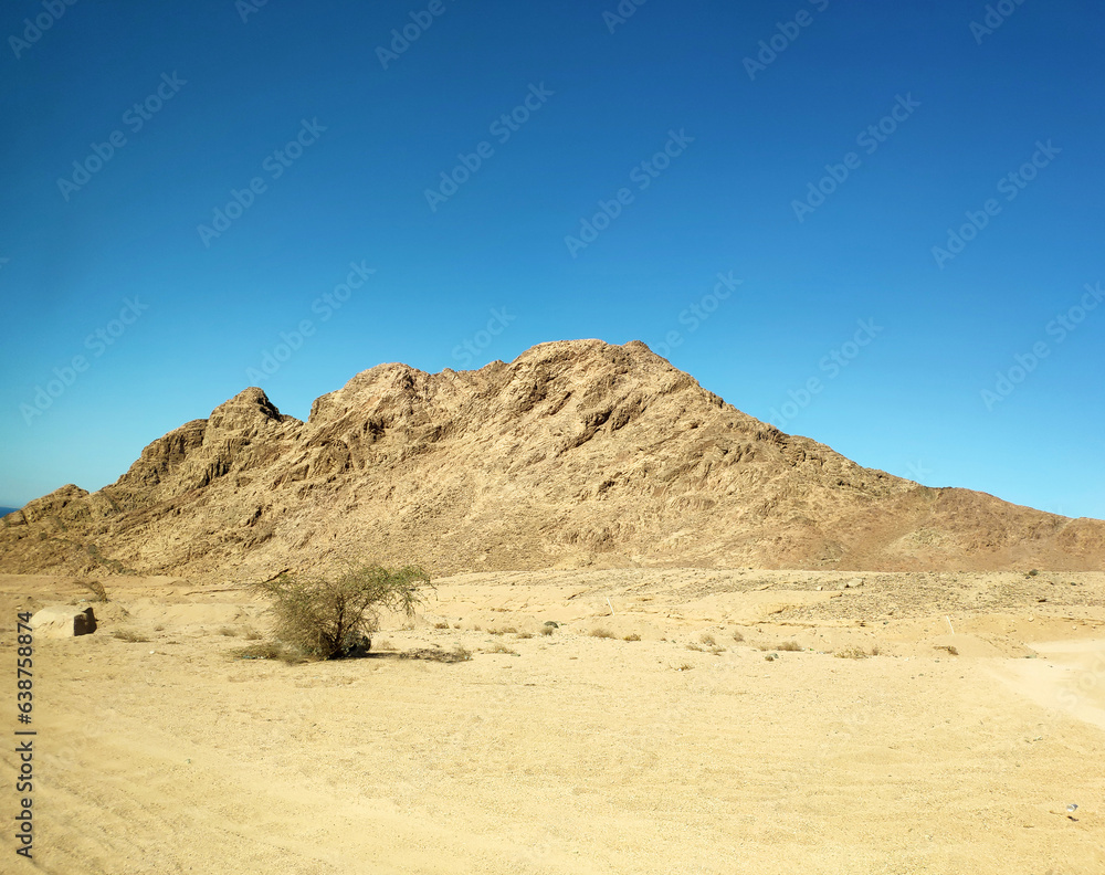 Desert land with mountains and sea