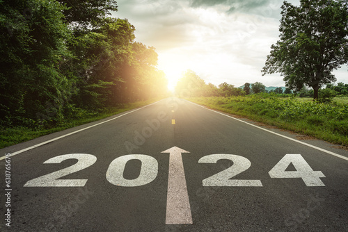 New year 2024 or straightforward concept. Text 2024 written on the road in the middle of asphalt road at sunset.Concept of planning and challenge, business strategy, opportunity ,hope, new life change