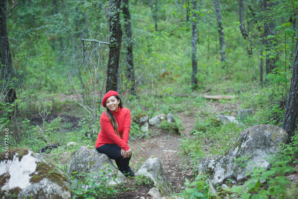 Woman with a positive attitude admiring the forest.