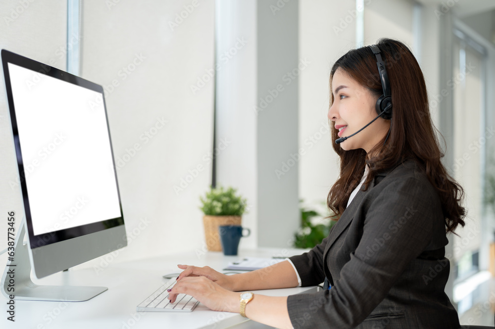A beautiful Asian female customer support agent is helping a customer fix their problems online. A beautiful Asian female customer support agent is helping a customer fix their problems online.