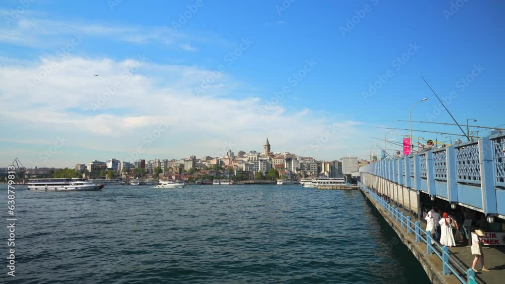Galata Tower on the other side of bridge. The popular tourist attraction of the european part of the city. Istanbul, Turkey Galata Tower on the other side of bridge. The popular tourist attraction of the european part of the city. Istanbul, Turkey